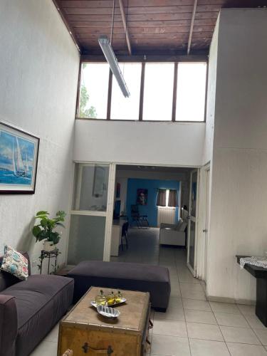 a living room with a couch and a table at Casa Altamirano in La Paz