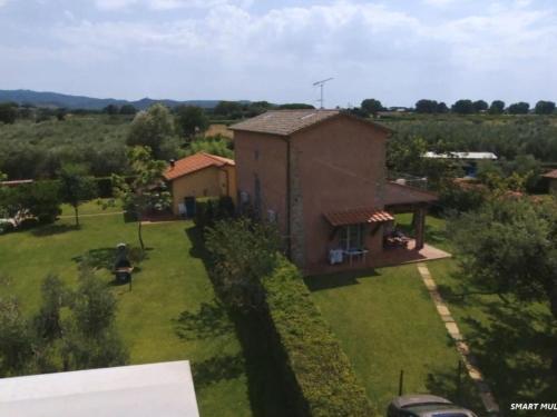 an aerial view of a small house in a field at Apartment Wohnung Leccio by Interhome in Castagneto Carducci