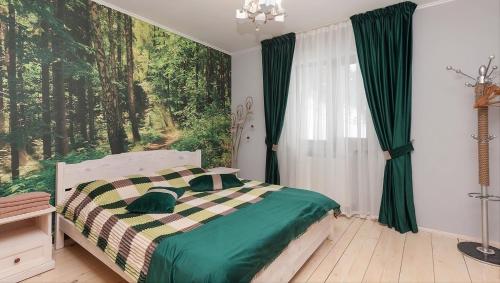 a bedroom with a bed and a large window at Котедж "У Мадяра" in Mykulychyn