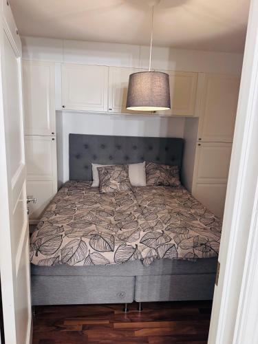 a bedroom with a bed in a small room at Asken 8 in Klippan