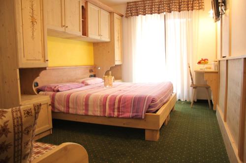 Postel nebo postele na pokoji v ubytování Hotel Lory