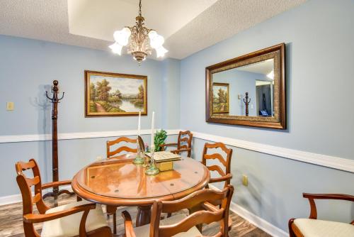 a dining room with a table and chairs and a mirror at Less Than 4 Mi to Sugar Mtn Resort Condo with Indoor Pool! in Sugar Mountain