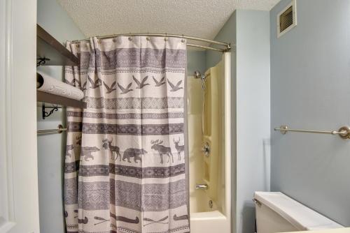 a bathroom with a shower curtain with animals on it at Less Than 4 Mi to Sugar Mtn Resort Condo with Indoor Pool! in Sugar Mountain