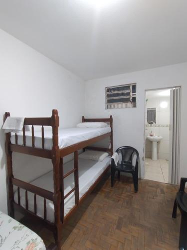 a room with two bunk beds and a bathroom at Centro de Convenções - Hospedagem in Recife