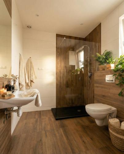 a bathroom with a shower and a sink and a toilet at Apartamenty koło Szczyrku A&S Spa - basen, jacuzzi, sauna in Szczyrk