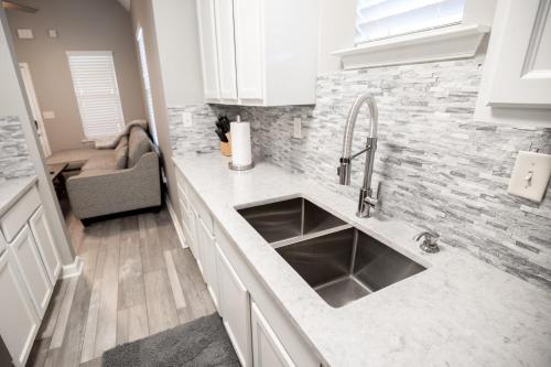 a kitchen with a sink and a counter top at Memphis Charm in Memphis
