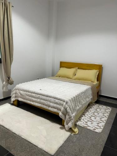 Come chez soi tesisinde bir odada yatak veya yataklar