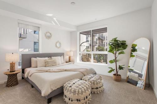 a bedroom with a large bed and a large window at Luxury 1BDR centrally located in Hollywood in Los Angeles
