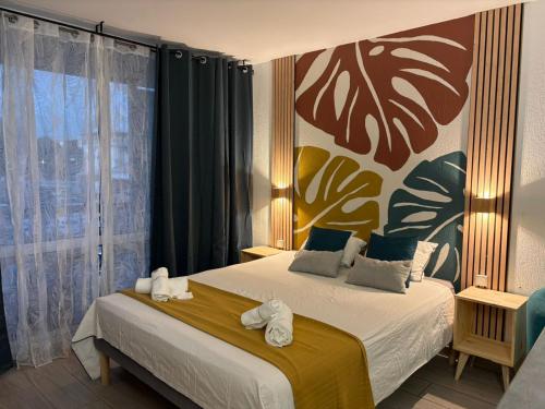 a bedroom with two beds with towels on them at Studio en bord de mer - létama - Résidence Archipel Savane in Le Gosier