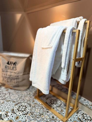 a towel on a towel rack in a room at Bubble Sky Villas Kosove in Ferizaj