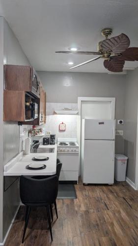 a kitchen with a stove and a white refrigerator at Private, Spacious & Comfy 1 bedroom Entire Suite With Separate Entry & Free Parking in Holbrook