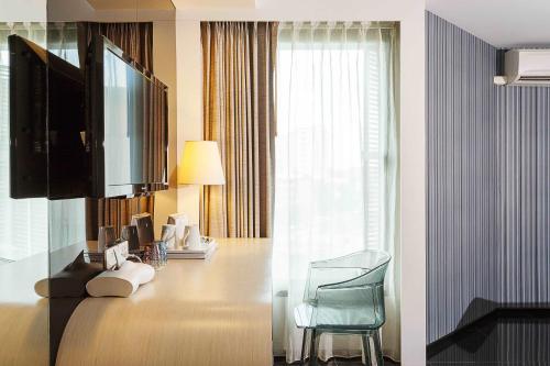 Ein Bett oder Betten in einem Zimmer der Unterkunft ibis Styles Chiang Mai