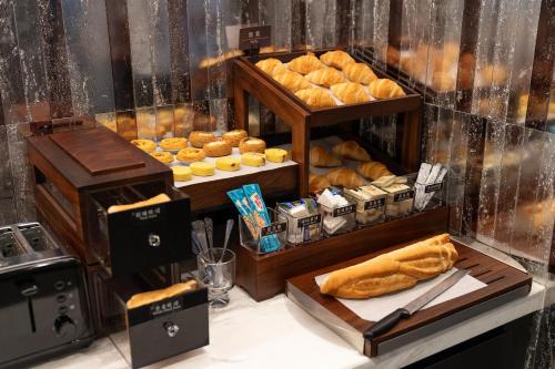 a bakery with a display of bread and pastries at Atour X Hotel Chengdu Qingbaijiang Wanda in Chengdu