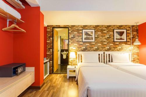 Ein Bett oder Betten in einem Zimmer der Unterkunft ibis Styles Chiang Mai