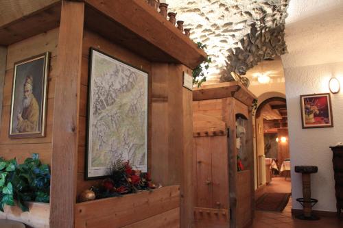 a room with a wall with a map on it at Hotel Ottoz Meublé in Courmayeur