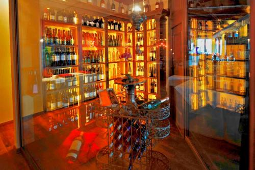 a room with a bar with bottles of alcohol at Schloss Hotel Korb in Appiano sulla Strada del Vino
