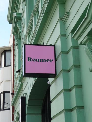 a sign that reads resonance on the side of a building at Roamer St Kilda in Melbourne