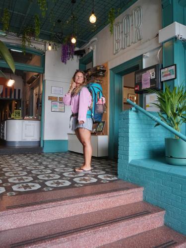 a woman is standing outside of a store at Roamer St Kilda in Melbourne