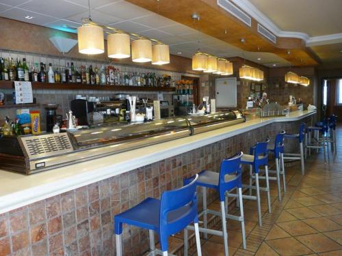 
a restaurant kitchen with a large counter top at Hotel Restaurante El Tollo in Utiel
