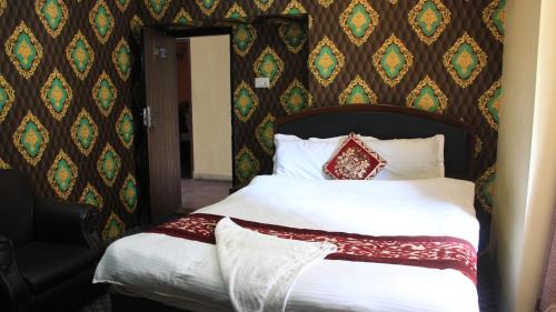 a bed in a hotel room with at Bhuwani Himalayan Height Hotel in Kathmandu
