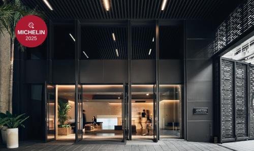 an entrance to a building with revolving doors at Kimpton Da An Taipei by IHG in Taipei