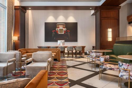 a lobby with a painting of a car on the wall at Home2 Suites By Hilton Chicago McCormick Place in Chicago