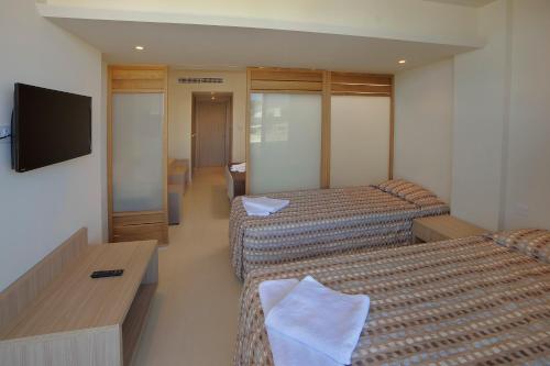 Katil atau katil-katil dalam bilik di Nelia Beach Hotel & Spa
