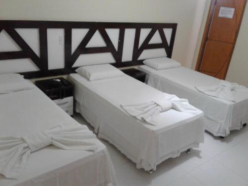 Postel nebo postele na pokoji v ubytování Hotel Columbia