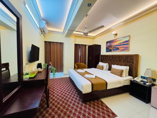 เตียงในห้องที่ Hotel Beach Park