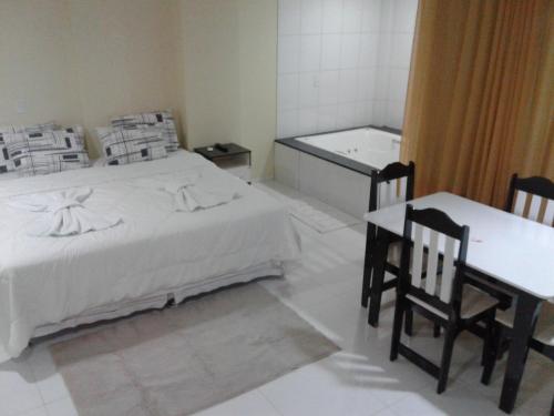 Ένα ή περισσότερα κρεβάτια σε δωμάτιο στο Hotel Columbia
