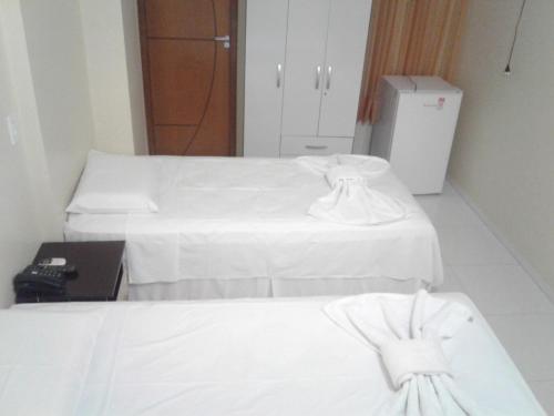 Ένα ή περισσότερα κρεβάτια σε δωμάτιο στο Hotel Columbia