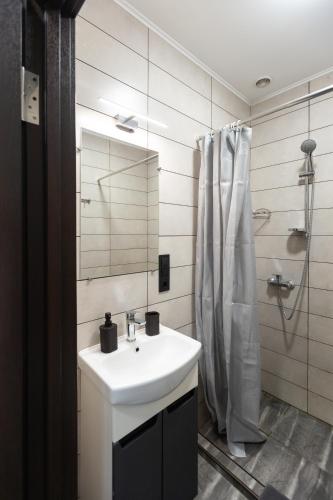 a bathroom with a sink and a shower at Shatiz in Izki