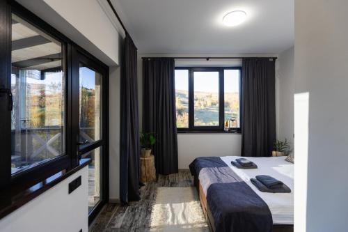 a bedroom with a bed and a large window at Shatiz in Izki