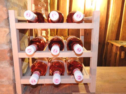 a bunch of bottles of wine on a shelf at Halász Airport Panzio in Vecsés