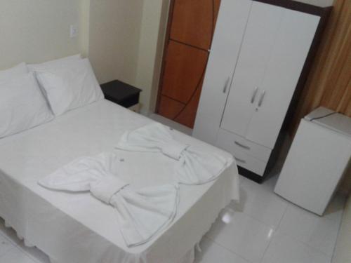 Ένα ή περισσότερα κρεβάτια σε δωμάτιο στο Hotel Columbia