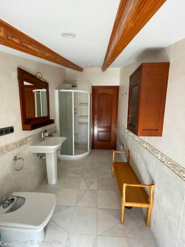a bathroom with a sink and a shower at Casa Rural El Junquillo in Cuevas de San Marcos