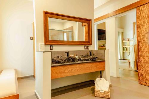 a bathroom with a sink and a mirror at Soul Spring Sanctuary Cuernavaca, WorldHotels Luxury in Xochitepec