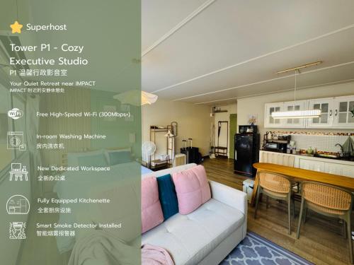 a room with a couch and a table and a kitchen at IMPACT challenger ห้องพักรายวัน เมืองทองธานี ตึก C9, P2, P1 每日房 in Nonthaburi
