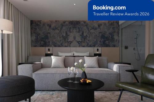 a living room with a couch and a table at December Hotel in Nha Trang