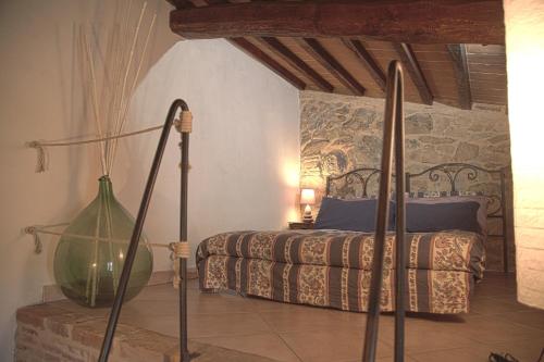 Ένα ή περισσότερα κρεβάτια σε δωμάτιο στο Agriturismo San Giusto