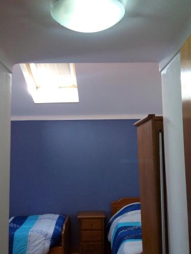 Una cama o camas en una habitación de Residencial Moeda