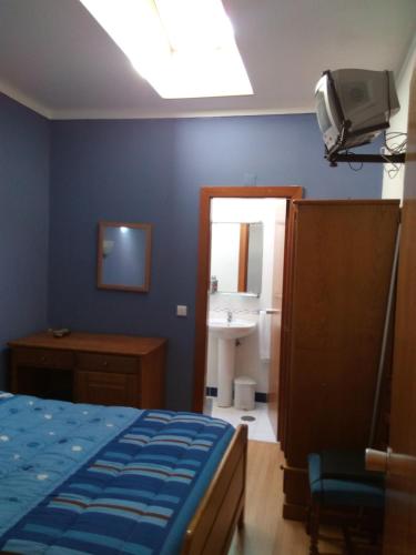 Una cama o camas en una habitación de Residencial Moeda
