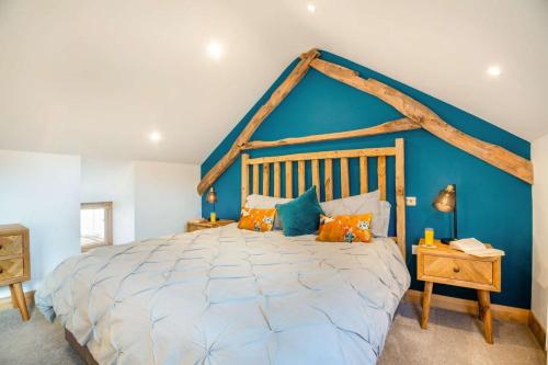 a bedroom with a large bed with a blue wall at 1 Bed in Bala oc-b27365 in Bala