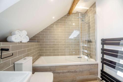 a bathroom with a toilet and a bath tub at 1 Bed in Bala oc-b27365 in Bala