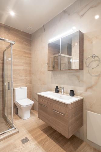 a bathroom with a sink and a toilet and a shower at LightHouse Portaria in Portaria