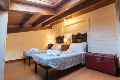 En eller flere senge i et værelse på Appartamenti Pomelia Punta Secca