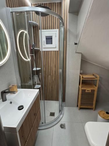 a bathroom with a shower and a sink at Sani Luxury Pool Villa in Sani Beach