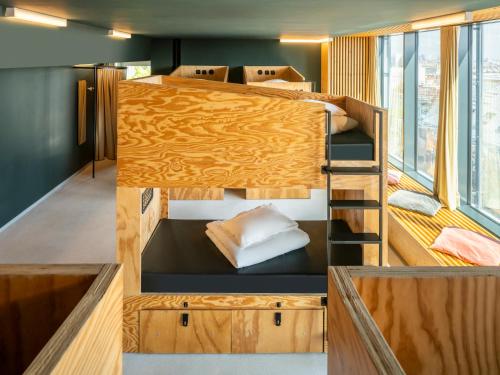 a group of bunk beds in a room at JO&JOE Vienna in Vienna