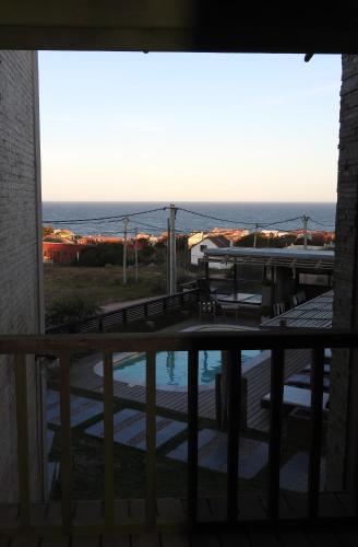 a view of the ocean from a balcony at Calas del Diablo in Punta Del Diablo