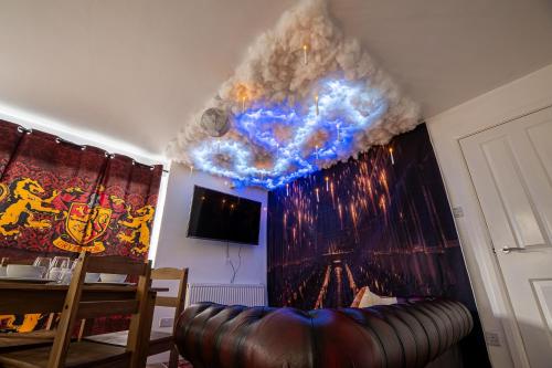 a living room with a couch and a ceiling at Magical Harry Potter Retreat 9 Mins to Studio Tour in Leavesden Green